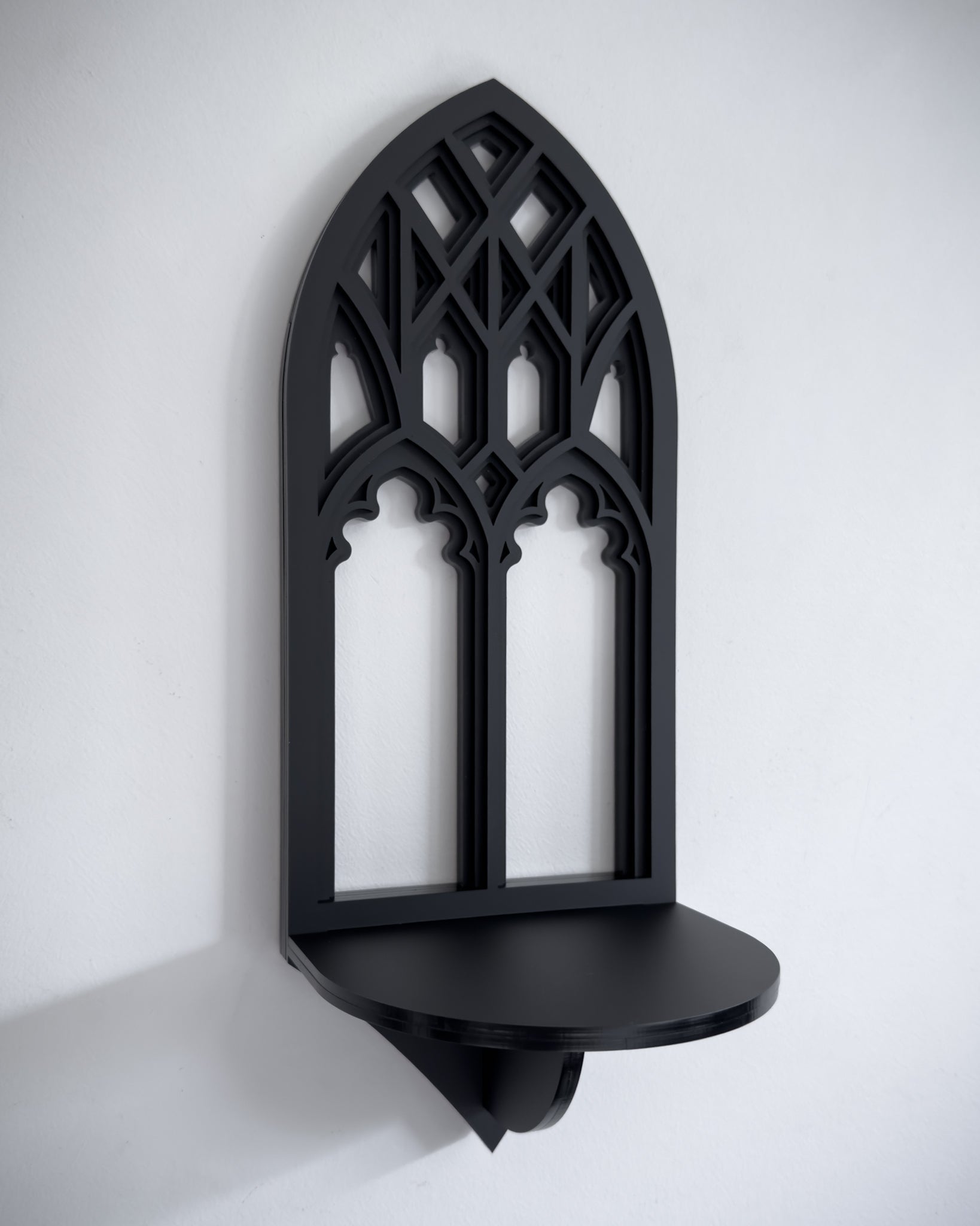 Close-up of Salem gothic tracery cathedral wall shelf in black layered acrylic