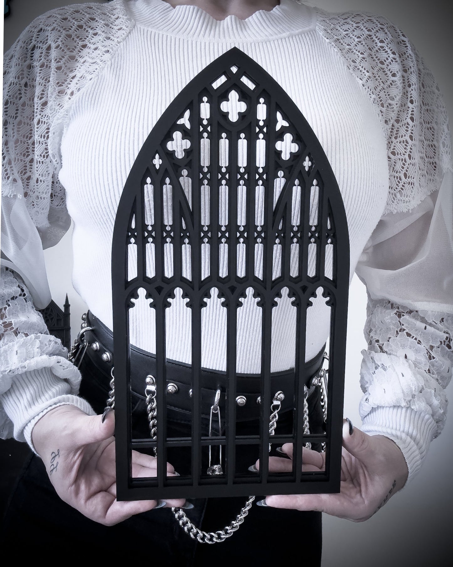 Salem gothic tracery cathedral window wall art in black layered acrylic held for size reference