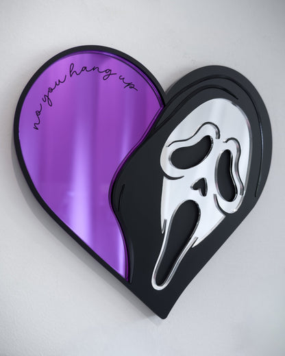 Ghostface heart mirror with purple acrylic and engraved text “no you hang up” mounted on a white wall
