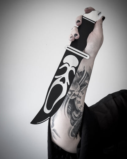 Ghostface knife mirror wall art shown in hand for scale