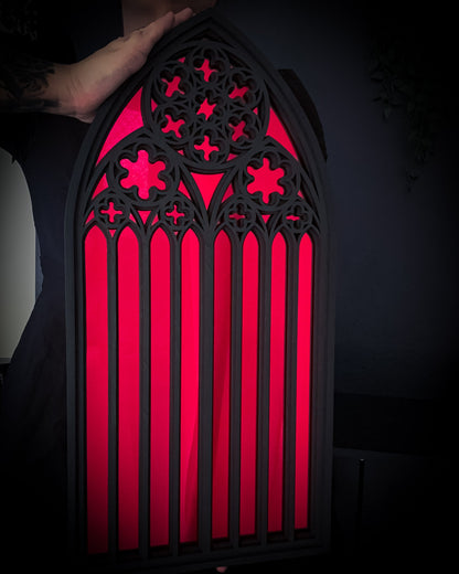 Large St Mary’s Cathedral arch mirror in red, gothic cathedral wall mirror shown being held for scale