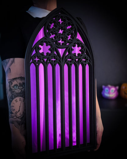 Large St Mary’s Cathedral arch mirror in purple, gothic cathedral wall mirror shown being held for scale