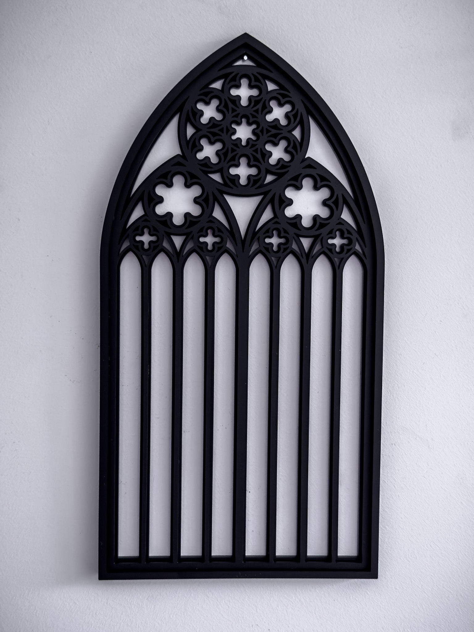 St Mary’s Cathedral tracery wall art in black layered acrylic shown on a white wall