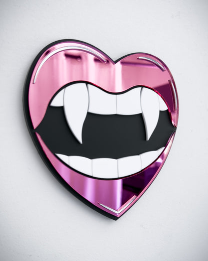 Side view of Gothic vampire lips mirror wall art in pink acrylic with fangs and black centre